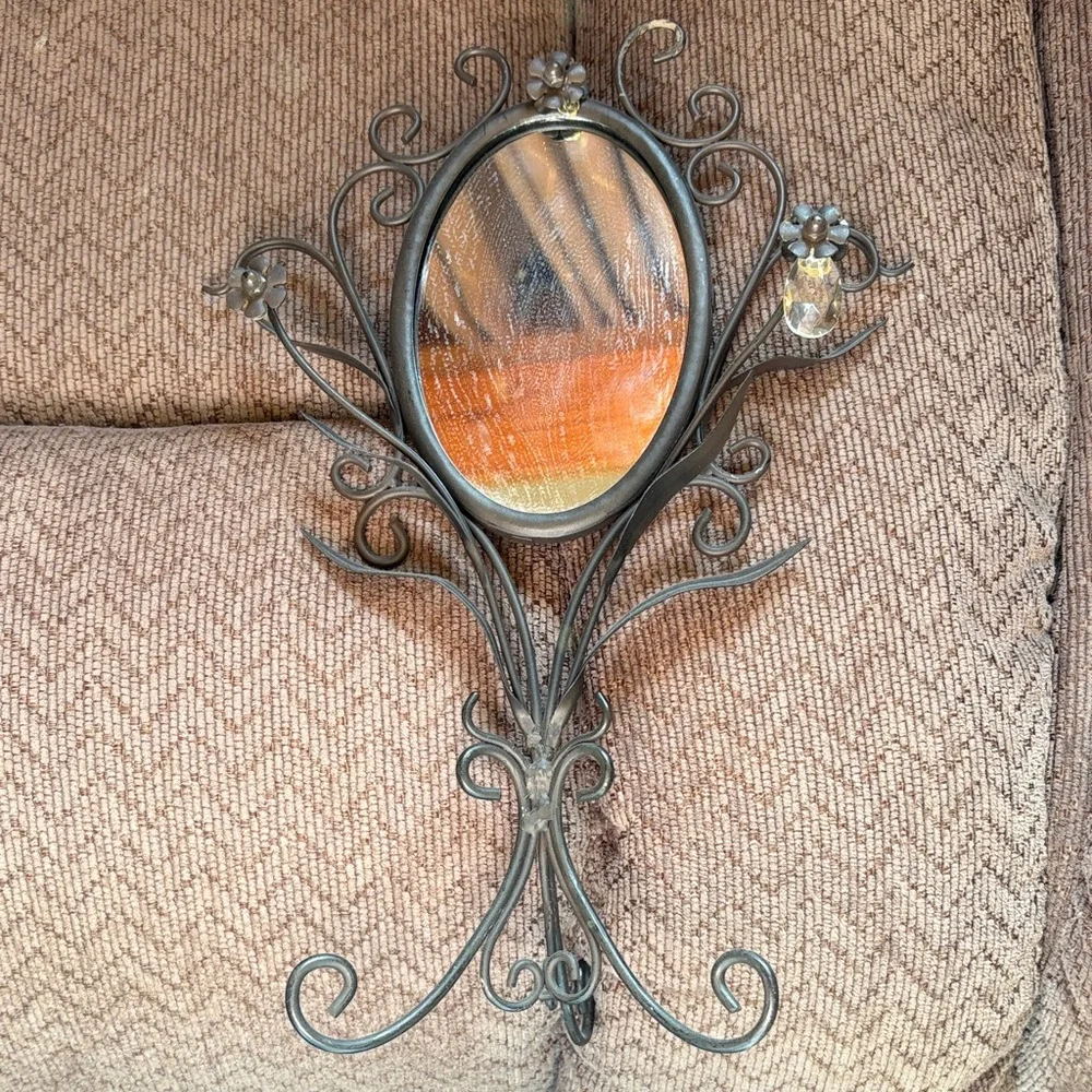 Elegant Black Wall Mirror with Floral Accents